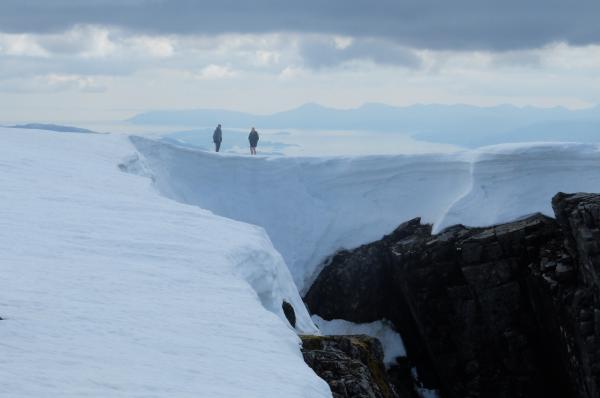 Photo of Zoomed image of unknown walkers getting close to cornice edge