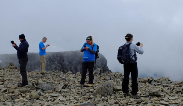 Photo of Group at top of Ben Nevis messaging their success