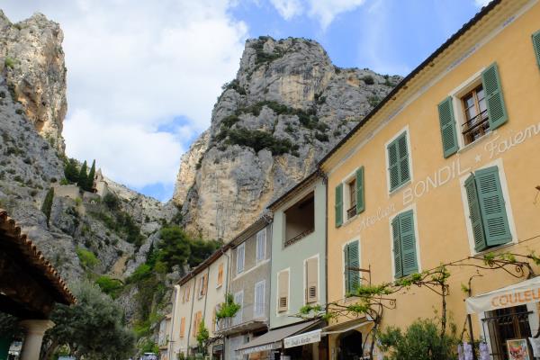 Photo of Looking up to Notre Dame de Beauvoir between rocks from streets of Moustiers Saint Marie
