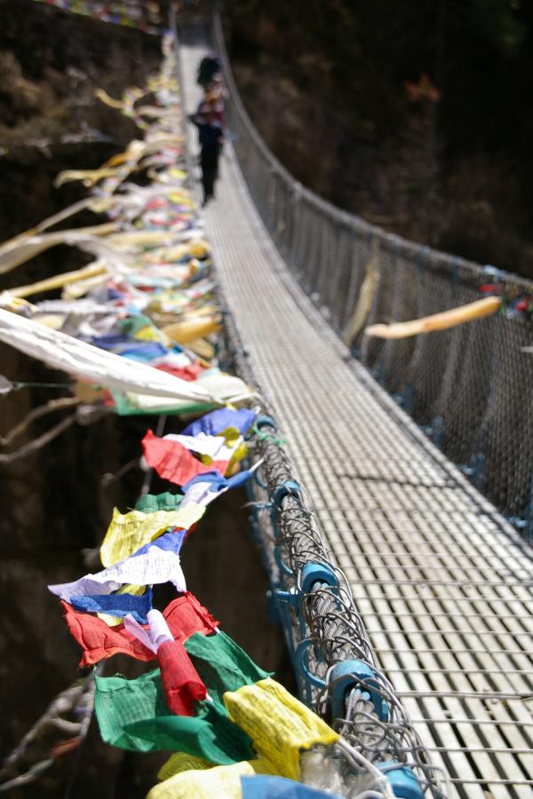 Photo of Prayer flags on footbridge